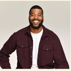 Lorne Jenkins, Executive Director, in a burgundy shirt over a white tee.